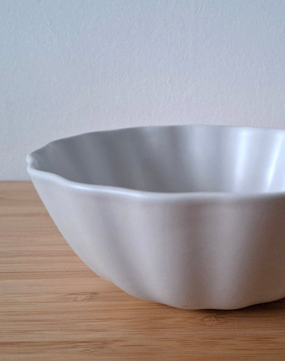Satin white minimalistic ceramics wavy bowl
