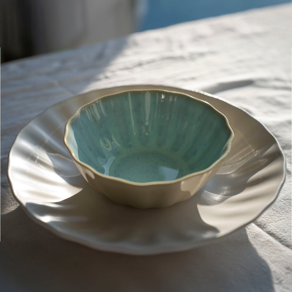 White ripple Bowl large and small ripple Bowl blue, stacked ceramics on white tablecloth